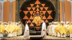 The final scene of Mozart's "The Magic Flute." Two actors standing across from each other on an elaborate set.