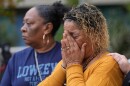 Bernice Bass, left, and Teresa Spivey, family members of Patrice Williams, who was hosting a party for her daughter where gunfire broke out, react while being interviewed in Stockton, Calif., Monday, Dec. 1, 2025.
