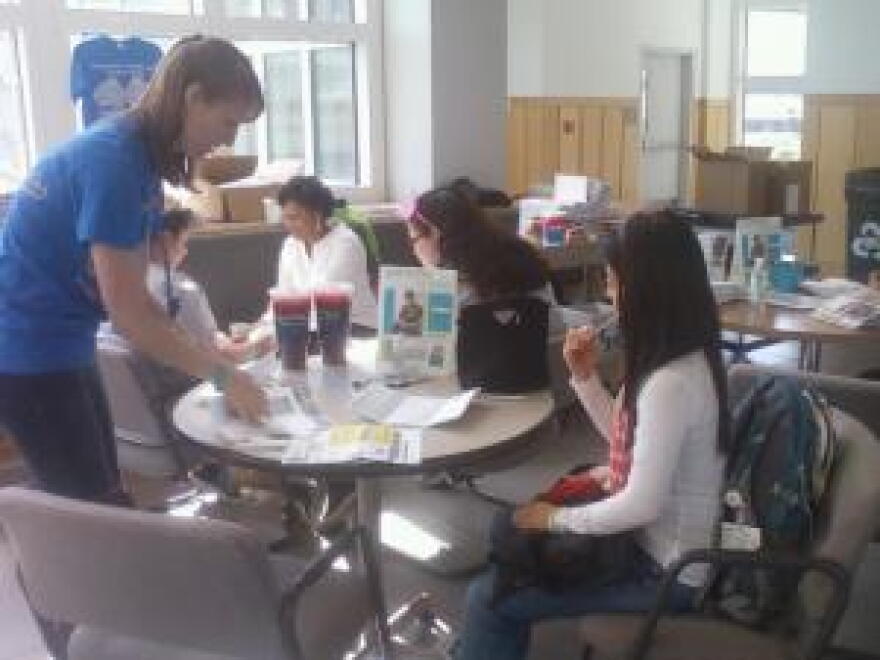 Bone marrow donor Monica Choe swabs her cheek as part of the registration process