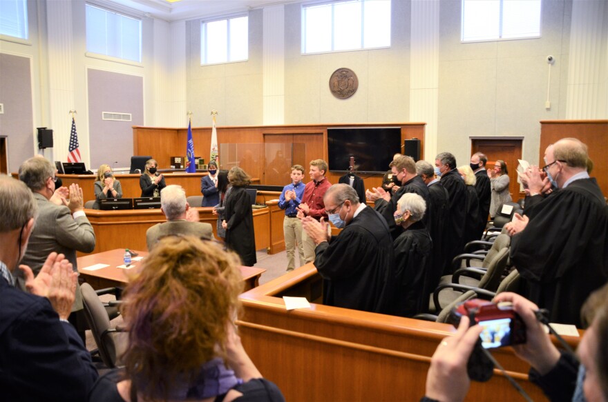 The courtroom applauds as Judge Milanowski finishes her oath.