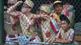 Members of the Little League team from Henderson, Nev., stand in their dugout during the sixth inning of the Little League World Series Championship baseball game against Curacao in South Williamsport, Pa., Sunday, Aug. 30, 2026. (AP Photo/Gene J. Puskar)