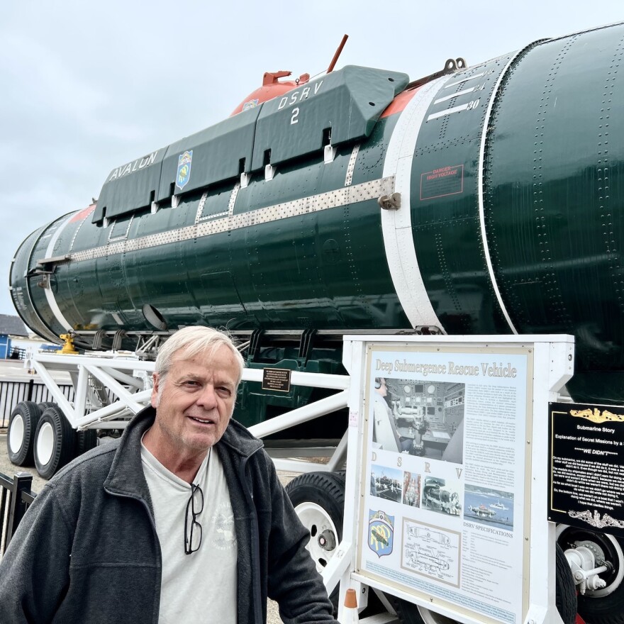 Larry Newland at Morro Bay Maritime Museum in front of US Navy (DSRV) Deep Submergence Rescue vessel
