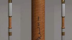 Olympic Torch from the
1996 Atlanta games signed by Muhammad
Ali. (Courtesy of the Collection of the Smithsonian National Museum of African American History and Culture)