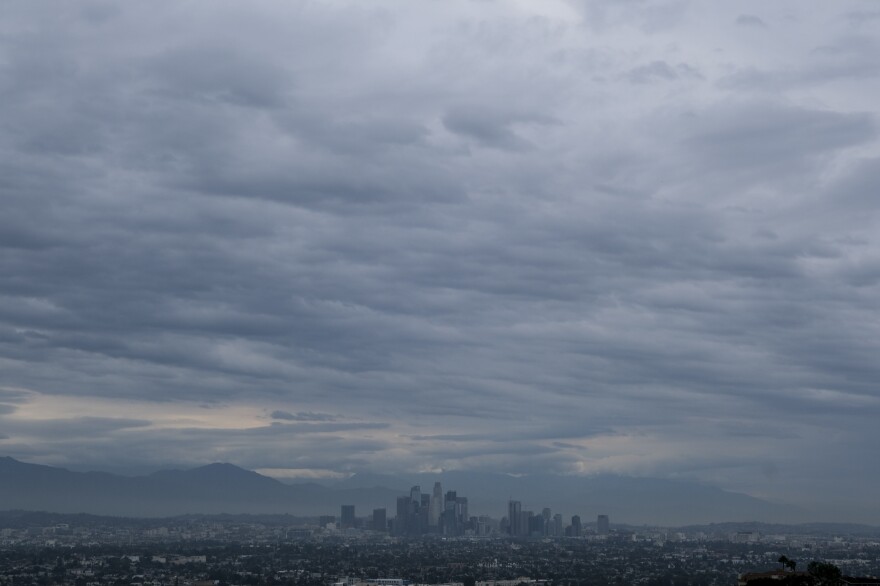 Storm clouds move over the Los Angeles skyline as seen from Kenneth Hahn State Recreation Area on Saturday.