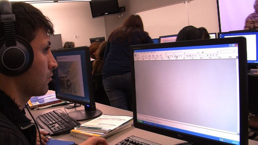 Alan Tyari, 25, works on his English language skills at Cuyamaca College. He hopes to open his own beauty salon one day.