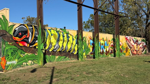 Local artist Justin Withrow designed and painted "The Moth Within," intended to be the first of a series of murals along East Main Street on Columbus' East Side. The "Mural on Main" effort is aimed at beautifying the area between Bexley and Whitehall.