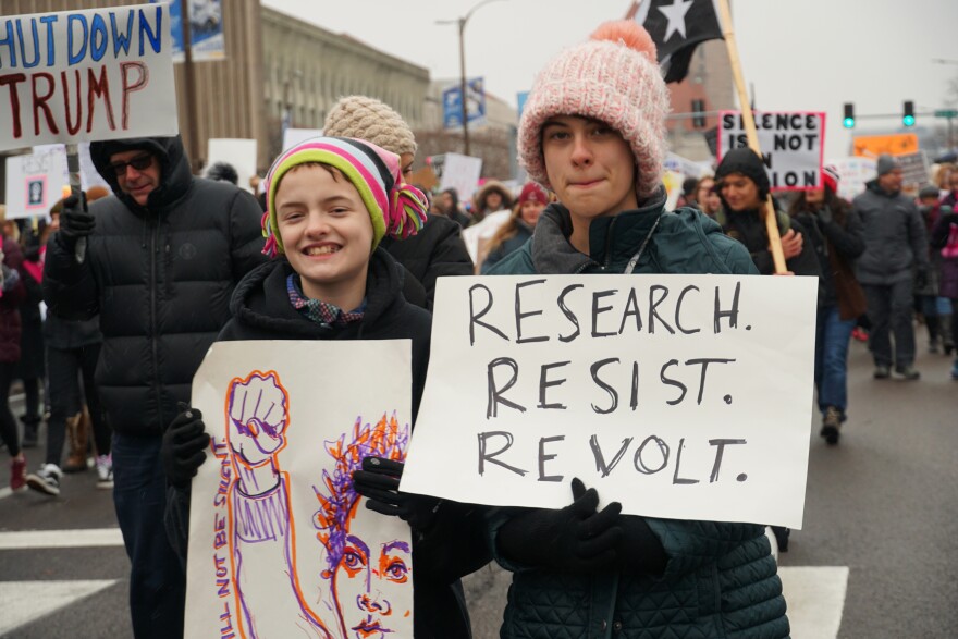 St. Louis Women's March participants walk along Market Street in downtown St. Louis on January 19, 2019.