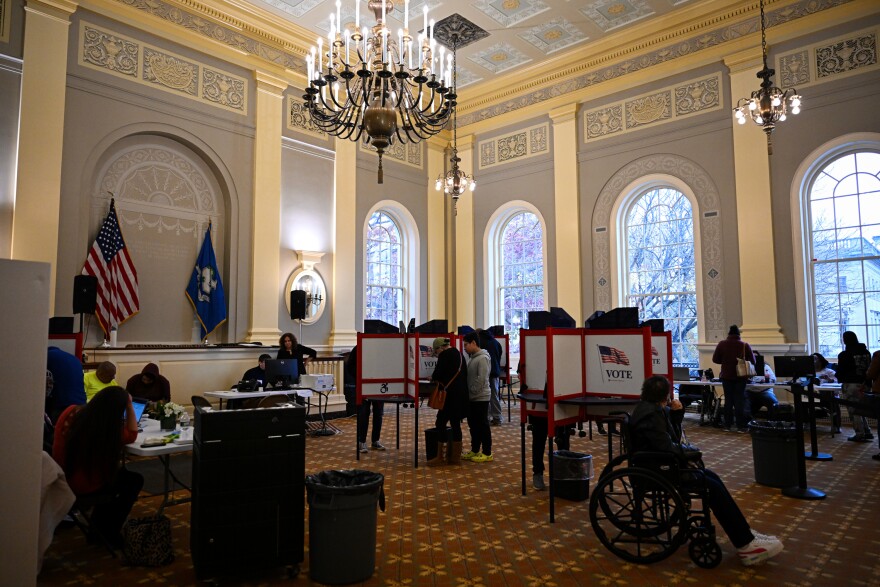 5th District early-voters cast their ballots in the Waterbury's Town Hall. The district, according to Quinnipiac University political science professor Scott McLean, was created to be competitive.