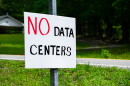 A sign protesting data center development
