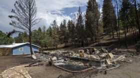 A flattened house that was destroyed by the South Fork Fire is shown in the mountain village of Ruidoso, N.M., Saturday, June 22, 2024. 