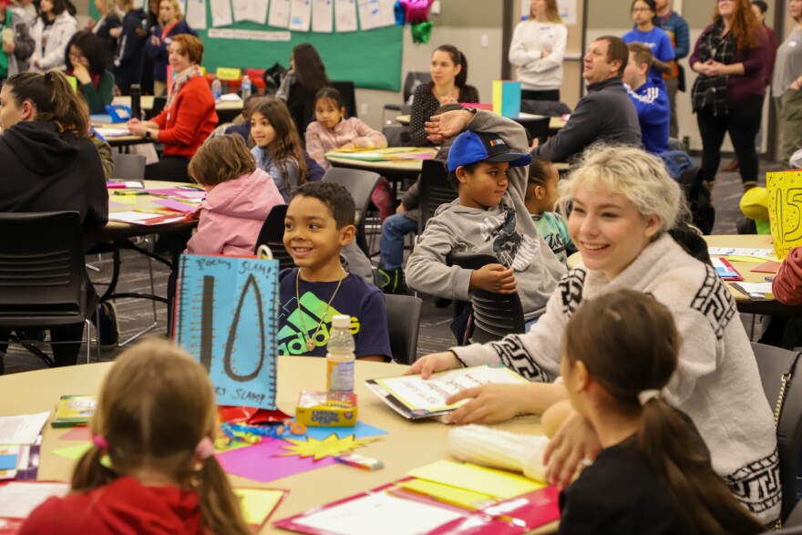 Stevens Elementary students work with staff and mentors from Spokane Community College to compose poems during the 13th annual 3rd Grade Poetry Slam