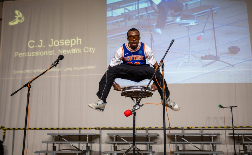 Visiting percussionist C.J. Joseph on the Cama'i stage on March 29, 2026 in Bethel, Alaska.