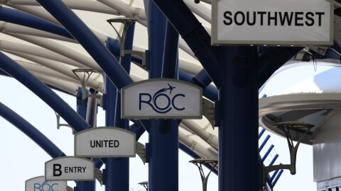 Signs at the Frederick Douglass Greater Rochester International Airport.