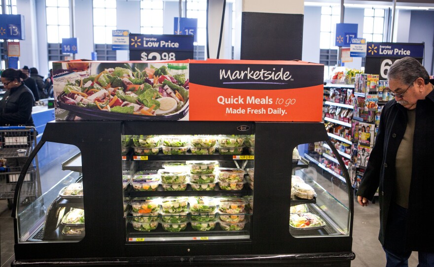 A customer peruses the ready-to-eat meal options at a Wal-Mart in Washington, D.C. In our grab-and-go times, freshly prepared meals are a big part of Wal-Mart's urban strategy.