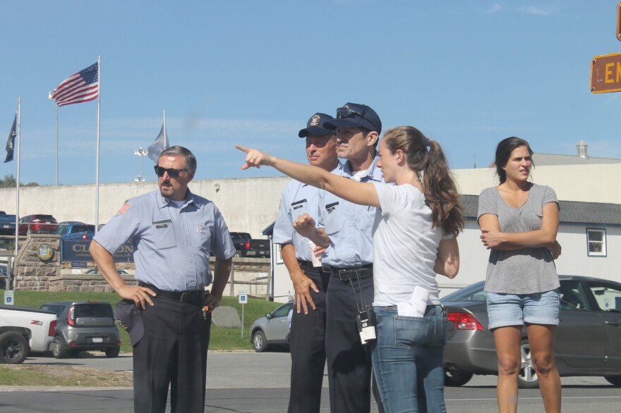 Actors playing corrections officers get instructions from a member of Ben Stiller's production crew on Wednesday. (Zach Hirsch/North Country Public Radio)