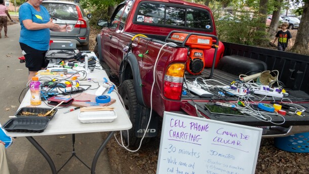 Meg Murphy volunteers outside the Swannanoa library at a charging station.