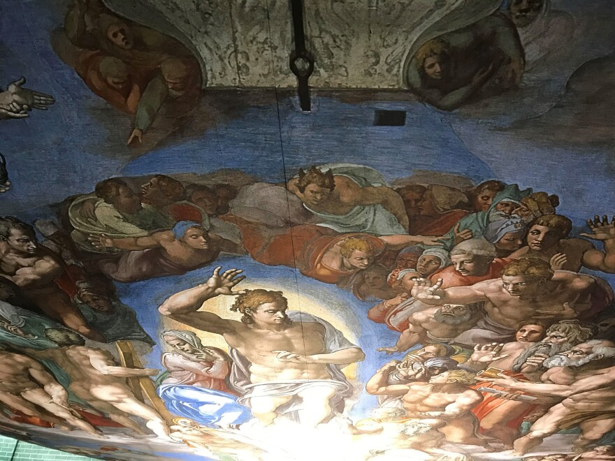 The Last Judgment is too large to stand up in the display, so the exhibit has it positioned on the ceiling.