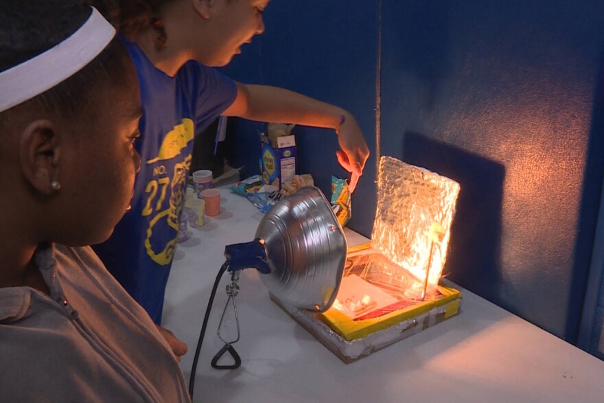 Seventh graders Tamyah Conner (left) and Bella Rollins (right) of Center for Inquiry School 27 in Indianapolis made a solar oven for the school's climate fair in 2019.