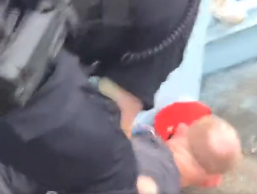 Still from video of Brandon Hill's July 17, 2025 arrest on the Roebling Bridge.