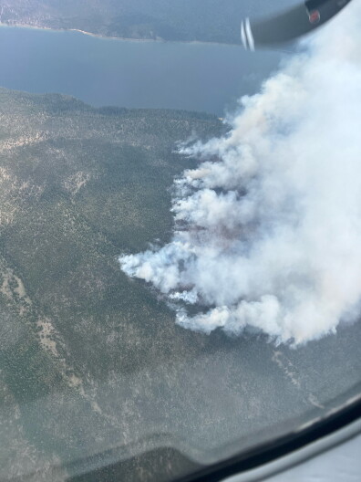 Water-scooping aircraft collecting water from Redfish Lake takes photo of the Bench Lake Fire on July 14.