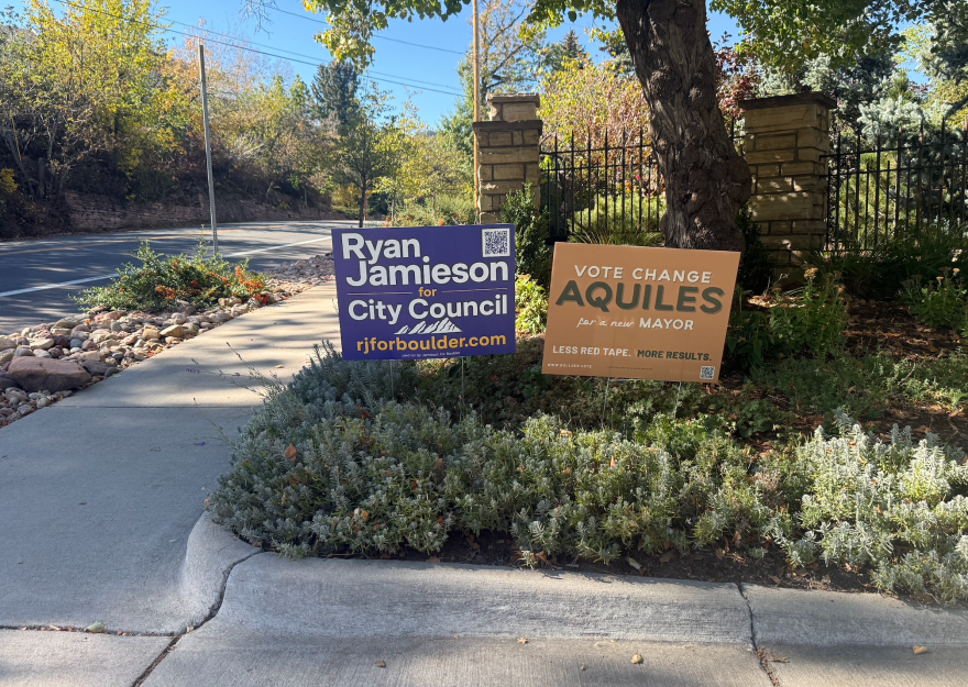 A sign endorsing Ryan Jamieson for city council is next to a sign endorsing Aquiles La Grave in Boulder’s mayoral race at the intersection of 11th Street and Baseline Road in Boulder on Oct. 21, 2026.