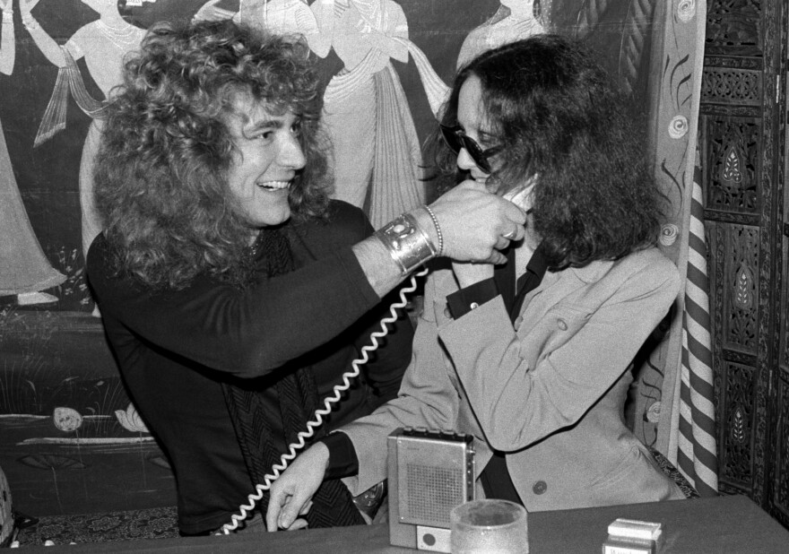 Robinson goofs around with Robert Plant at a New York City restaurant in 1976.