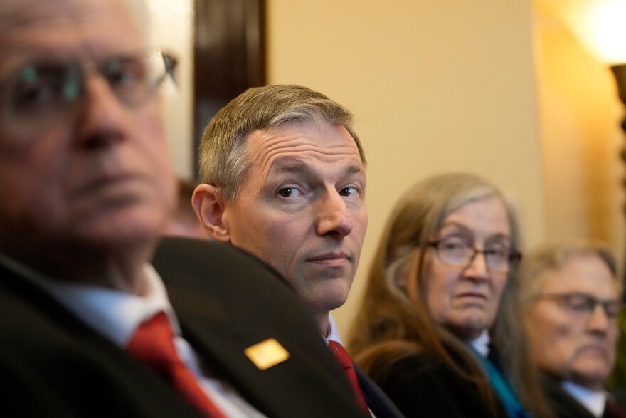 Utah State Sen. Mike Kennedy, second from left, speaks with reporters on the opening day of the Utah Legislative Session at the Utah State Capitol on Tuesday, Jan. 17, 2023, in Salt Lake City. Kennedy, a Republican family doctor sponsoring the Utah proposal, told reporters that it didn't make sense that health care policy related to gender and youth, which is at times irreversible, would be subject to no government oversight.