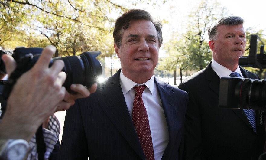 Former Trump campaign chairman Paul Manafort (left) arrives at a federal courthouse with his attorney Kevin Downing on Thursday in Washington, D.C.