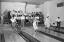 People bowling at an alley
