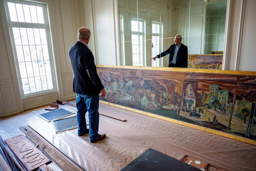 (Trent Nelson | The Salt Lake Tribune) George Daines with a portion of the historic mural at the Bluebird Cafe in Logan on Friday, March 7, 2025.