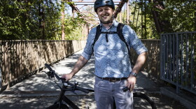 Bike commuter Bryan Bennion on his way to work on the Boise River Greenbelt. He says he's saved a lot of money in recent years by biking instead of driving.
