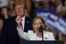 Sen. Darline Graham, R-S.C., speaks as President Donald Trump looks on at a campaign rally at the T. Ed Garrison Livestock Arena and Expo Center, Wednesday, Oct. 21, 2026, in Pendleton, S.C. (AP Photo/Mike Stewart)