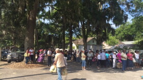 Hundreds of people turned out for a food giveaway by the Jacksonville branch of Farm Share Inc. at the Salvation Army on East University Tuesday. (TJ Pyche / WUFT News)