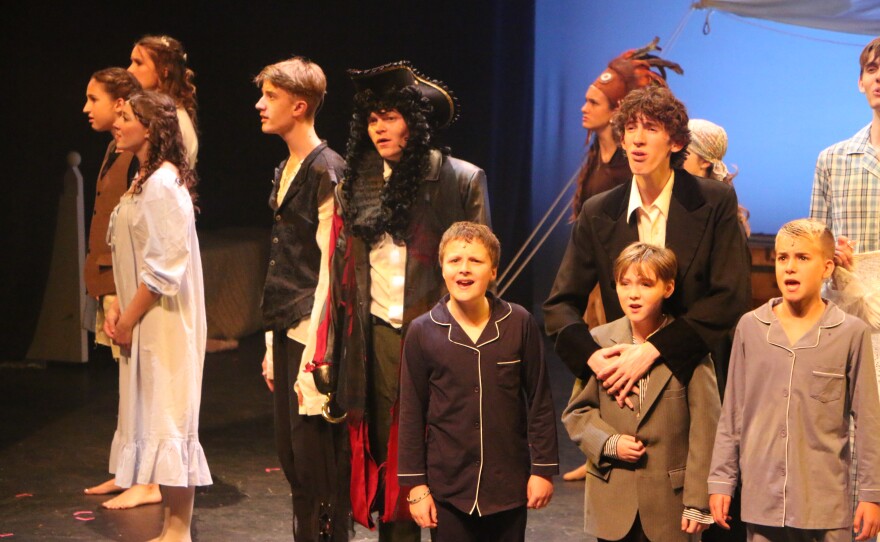 Mrs. Z’s Performing Arts Studio’s cast of Finding Neverland singing the finale of the show during a dress rehearsal. Photo by Allison Diaz.