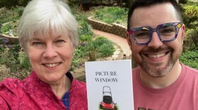 Kaye McIntyre, Danny Caine holding Picture Window book