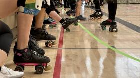 roller derby players on the bench