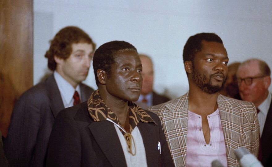 Zimbabwe African National Union leader Robert Mugabe in Geneva, Switzerland, 1976. Others are unidentified.