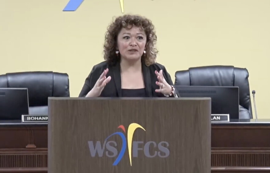 Walkertown Middle School Principal Monica Comer speaks at a podium