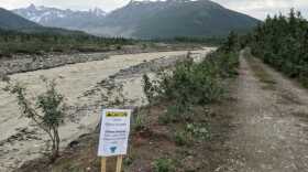 A sign warning on the bank of a creek