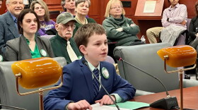 William Schloat told lawmakers, “If I had a time machine, I would travel back to Hartford in the 1600s to help the people who are being accused of witchcraft." Two rows behind him at right is Rep. Jane Garibay, sponsor of the exoneration resolution.