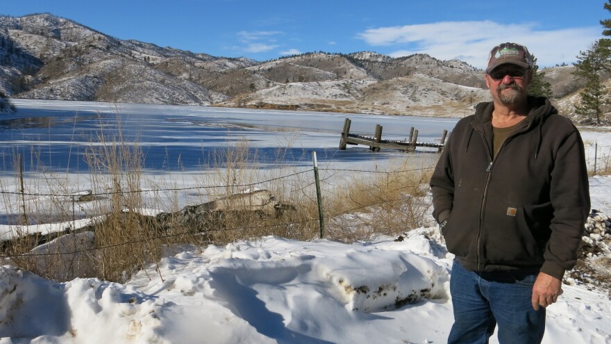 Reservoir caretaker Doug Billingsley stands in his front yard — just yards away from the Milton Seaman Reservoir north of Fort Collins.
