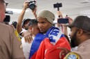 Cuban dissident artist Luis Manuel Otero Alcántara embraces a supporter as he arrives at Miami International Airport on Saturday, July 18, 2026, after serving a five-year prison sentence in Cuba.