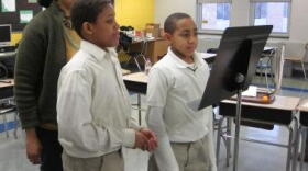 Teaching artist Annette Daniels-Taylor with school #39 students Josiah Mallory and Jordon Kerr