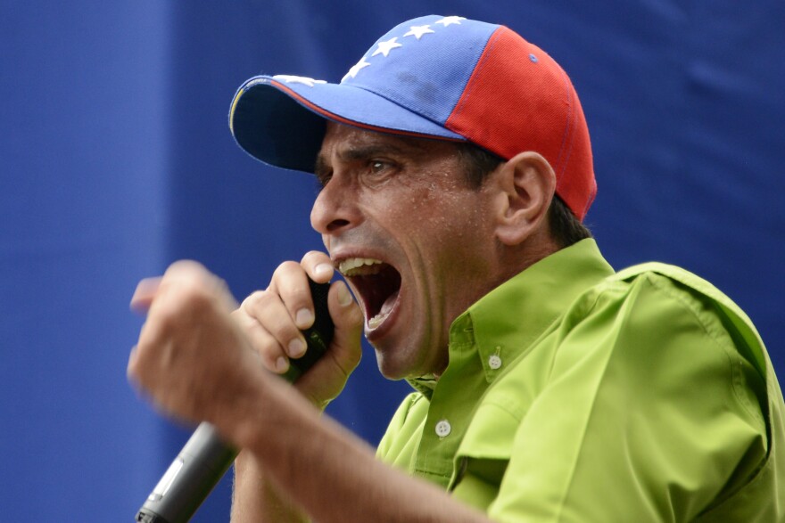 Venezuelan opposition leader and Miranda state governor Henrique Capriles speaks during a mass protest in Caracas on Saturday.