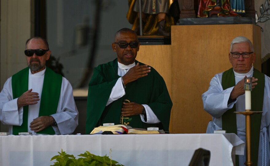 Rev. Michael Rowe leads the congregation during the Mass on Monday.