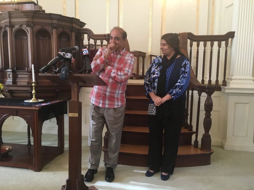 Rehman gets emotional as he talks to the media before he and Altaf leave the church.