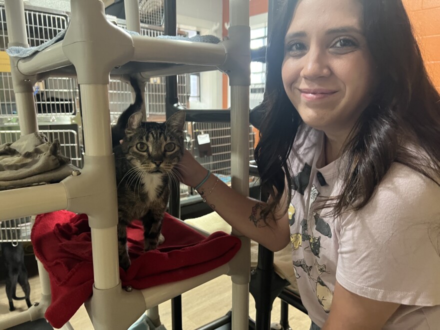 Tiffany Daniel, Vice President of Programs at the Pensacola Humane Society, with 9-year-old Juanita
