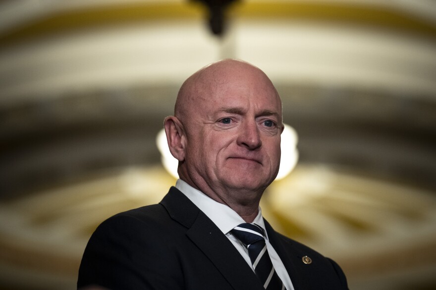 Sen. Mark Kelly (D-AZ) waits to speak during a news conference following a closed-door lunch meeting with Senate Democrats at the U.S. Capitol March 22, 2023 in Washington, D.C.