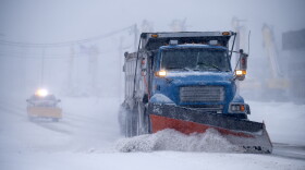 As plows continue throughout the day, visibility remains low.