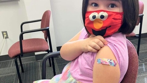 Annabelle Jimenez, a 5-year-old Hickory resident, shows off her Band-Aid after receiving a COVID-19 vaccine.